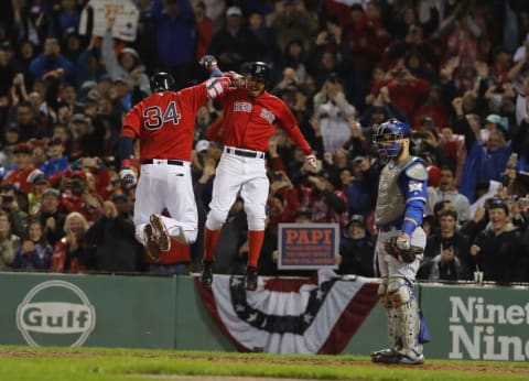 Sep 30, 2016; Boston, MA, USA; Boston Red Sox designated hitter David Ortiz (34) celebrates his two run home run with right fielder Mookie Betts (50) against the Toronto Blue Jays in the seventh inning at Fenway Park. Mandatory Credit: David Butler II-USA TODAY Sports