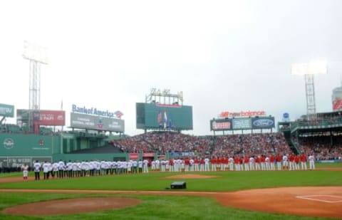 Oct 2, 2016; Boston, MA, USA; Members of the 2004 2007 an 2013 World Series team as well as current players lineup for the national anthem prior to a game against the Toronto Blue Jays at Fenway Park. Mandatory Credit: Bob DeChiara-USA TODAY Sports