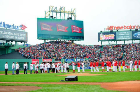 Oct 2, 2016; Boston, MA, USA; Members of the 2004 2007 2013 World Series team as well as current players gather in the infield as part of pregame ceremonies in honor of designated hitter David Ortiz (34) before a game against the Toronto Blue Jays at Fenway Park. Mandatory Credit: Bob DeChiara-USA TODAY Sports