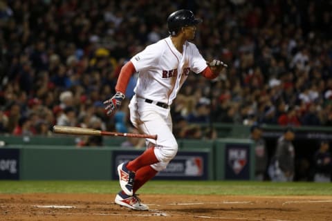 Oct 10, 2016; Boston, MA, USA; Boston Red Sox shortstop Xander Bogaerts (2) singles in the second inning against the Cleveland Indians during game three of the 2016 ALDS playoff baseball series at Fenway Park. Mandatory Credit: Greg M. Cooper-USA TODAY Sports