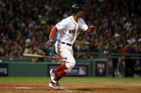 Oct 10, 2016; Boston, MA, USA; Boston Red Sox shortstop Xander Bogaerts (2) singles in the second inning against the Cleveland Indians during game three of the 2016 ALDS playoff baseball series at Fenway Park. Mandatory Credit: Greg M. Cooper-USA TODAY Sports