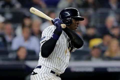 NEW YORK, NEW YORK – OCTOBER 08: Didi Gregorius #18 of the New York Yankees hits an RBI single to score Luke Voit #45 against Nathan Eovaldi #17 of the Boston Red Sox during the fourth inning in Game Three of the American League Division Series at Yankee Stadium on October 08, 2018 in the Bronx borough of New York City. (Photo by Elsa/Getty Images)