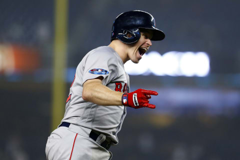 NEW YORK, NEW YORK – OCTOBER 08: Brock Holt #12 of the Boston Red Sox celebrates after hitting a two-run home run against Austin Romine #28 of the New York Yankees during the ninth inning in Game Three of the American League Division Series at Yankee Stadium on October 08, 2018 in the Bronx borough of New York City. (Photo by Mike Stobe/Getty Images)