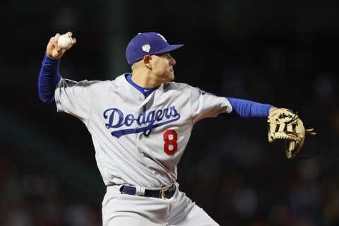 BOSTON, MA – OCTOBER 24: Manny Machado #8 of the Los Angeles Dodgers throws out J.D. Martinez (not pictured) #28 of the Boston Red Sox during the fourth inning in Game Two of the 2018 World Series at Fenway Park on October 24, 2018 in Boston, Massachusetts. (Photo by Elsa/Getty Images)