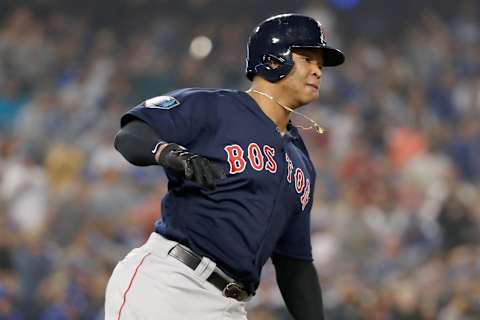 LOS ANGELES, CA – OCTOBER 27: Rafael Devers #11 of the Boston Red Sox runs to first base on his rbi single to center field in the ninth inning of Game Four of the 2018 World Series against the Los Angeles Dodgers at Dodger Stadium on October 27, 2018 in Los Angeles, California. (Photo by Sean M. Haffey/Getty Images)