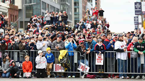 BOSTON, MA – October 31: Fans hold signs and wait for the Red Sox Victory Parade to pass on Duck boats on October 31, 2018, in Boston, Massachusetts. (Photo by Omar Rawlings/Getty Images)