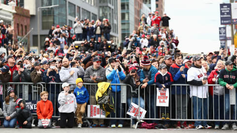 BOSTON, MA – OCTOBER 31: Fans hold signs and wait for the Red Sox Victory Parade to pass on Duck boats on October 31, 2018 in Boston, Massachusetts. (Photo by Omar Rawlings/Getty Images)