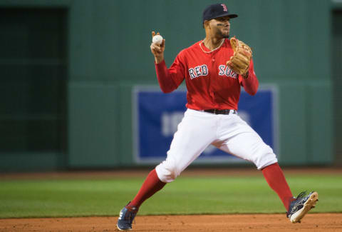 BOSTON, MA – APRIL 12: Xander Bogaerts #2 of the Boston Red Sox throws to first base to force an out in the second inning against the Baltimore Orioles at Fenway Park on April 12, 2019 in Boston, Massachusetts. (Photo by Kathryn Riley /Getty Images)