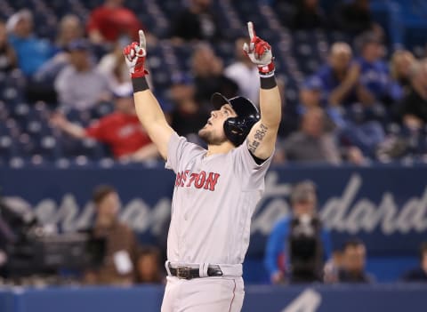 TORONTO, ON – MAY 22: Michael Chavis #23 of the Boston Red Sox celebrates after hitting the eventual game-winning solo home run in the thirteenth inning during MLB game action against the Toronto Blue Jays at Rogers Centre on May 22, 2019 in Toronto, Canada. (Photo by Tom Szczerbowski/Getty Images)