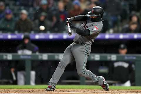 DENVER, COLORADO – MAY 28: Eduardo Escobar #5 of the Arizona Diamondbacks hits a RBI single in the fifth inning against the Colorado Rockies at Coors Field on May 28, 2019 in Denver, Colorado. (Photo by Matthew Stockman/Getty Images)