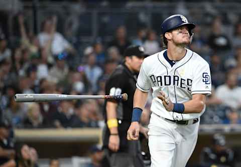 SAN DIEGO, CA – SEPTEMBER 7: Wil Myers #4 of the San Diego Padres flips his bat after hitting a solo home run during the fifth inning of a baseball game against the Colorado Rockies at Petco Park September 7, 2019 in San Diego, California. (Photo by Denis Poroy/Getty Images)