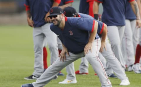 FORT MYERS, FLORIDA – FEBRUARY 17: Mitch Moreland #18 of the Boston Red Sox stretches during a team workout at jetBlue Park at Fenway South on February 17, 2020 in Fort Myers, Florida. (Photo by Michael Reaves/Getty Images)