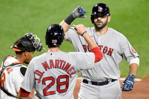 BALTIMORE, MD – AUGUST 20: Mitch Moreland #18 of the Boston Red Sox celebrates with J.D. Martinez #28 after hitting a three-run home run in the ninth inning against the Baltimore Orioles at Oriole Park at Camden Yards on August 20, 2020 in Baltimore, Maryland. (Photo by Greg Fiume/Getty Images)