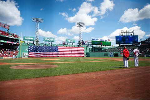 BOSTON, MA – APRIL 19: An American flag is dropped from the Green Monster prior to the start of the game between the Chicago White Sox and Boston Red Sox in honor of Patriots Day at Fenway Park on April 19, 2021 in Boston, Massachusetts. (Photo by Kathryn Riley/Getty Images)