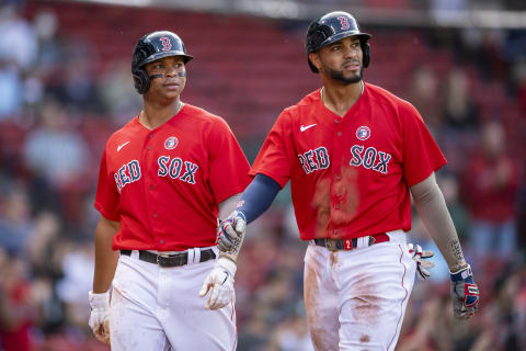 BOSTON, MA – MAY 15: Rafael Devers #11 and Xander Bogaerts #2 of the Boston Red Sox look on after scoring during the fourth inning of a game against the Los Angeles Angels of Anaheim on May 15, 2021 at Fenway Park in Boston, Massachusetts. (Photo by Billie Weiss/Boston Red Sox/Getty Images)