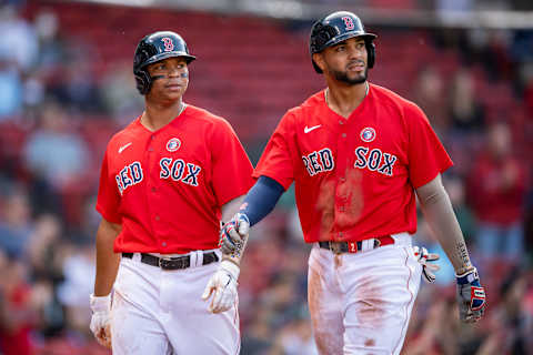 BOSTON, MA – MAY 15: Rafael Devers #11 and Xander Bogaerts #2 of the Boston Red Sox look on after scoring during the fourth inning of a game against the Los Angeles Angels of Anaheim on May 15, 2021 at Fenway Park in Boston, Massachusetts. (Photo by Billie Weiss/Boston Red Sox/Getty Images)