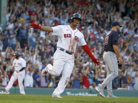 BOSTON, MA – SEPTEMBER 04: Rafael Devers #11 of the Boston Red Sox reacts after he hit a three-run home against the Cleveland Indians in the seventh inning at Fenway Park on September 4, 2021 in Boston, Massachusetts. (Photo by Jim Rogash/Getty Images)