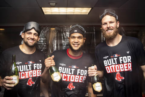 WASHINGTON, DC – OCTOBER 3: Nathan Eovaldi #17, Eduardo Rodriguez #57, and Chris Sale #41 of the Boston Red Sox pose for a photograph as they celebrate with champagne after clinching the American League Wild Card top seed after a game against the Washington Nationals on October 3, 2021 at Nationals Park in Washington, DC. (Photo by Billie Weiss/Boston Red Sox/Getty Images)