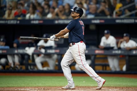 ST PETERSBURG, FL – OCTOBER 08: Rafael Devers #11 of the Boston Red Sox hits a two run home run during the eighth inning of game two of the 2021 American League Division Series against the Tampa Bay Rays at Tropicana Field on October 8, 2021 in St Petersburg, Florida. (Photo by Billie Weiss/Boston Red Sox/Getty Images)