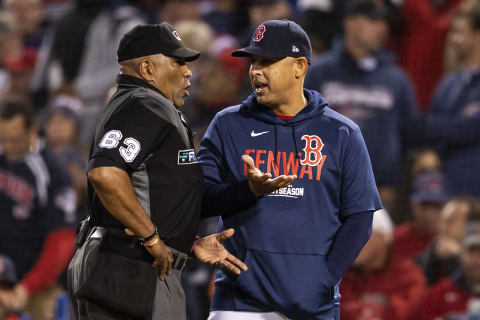 BOSTON, MA – OCTOBER 19: Manager Alex Cora of the Boston Red Sox argues with umpire Laz Diaz after he is called out on strikes during the third inning of game four of the 2021 American League Championship Series against the Houston Astros at Fenway Park on October 19, 2021 in Boston, Massachusetts. (Photo by Billie Weiss/Boston Red Sox/Getty Images)