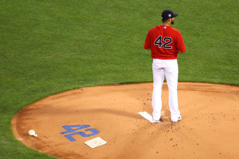 BOSTON, MASSACHUSETTS – AUGUST 28: Martin Perez #42 of the Boston Red Sox prepares to throw against the Washington Nationals during the first inning at Fenway Park on August 28, 2020 in Boston, Massachusetts. All players are wearing #42 in honor of Jackie Robinson Day. The day honoring Jackie Robinson, traditionally held on April 15, was rescheduled due to the COVID-19 pandemic. (Photo by Maddie Meyer/Getty Images)