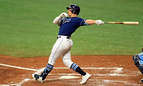 ST PETERSBURG, FLORIDA – SEPTEMBER 30: Hunter Renfroe #11 of the Tampa Bay Rays hits a grand slam home run in the second inning during Game Two of the American League Wild Card Series against the Toronto Blue Jays at Tropicana Field on September 30, 2020 in St Petersburg, Florida. (Photo by Mike Ehrmann/Getty Images)