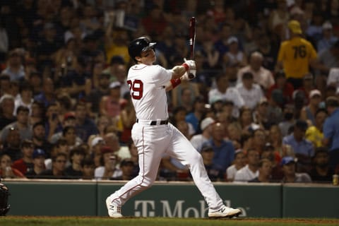 BOSTON, MA – AUGUST 11: Bobby Dalbec #29 of the Boston Red Sox follows through on a hit against the Tampa Bay Rays during the fourth inning at Fenway Park on August 11, 2021 in Boston, Massachusetts. (Photo By Winslow Townson/Getty Images)