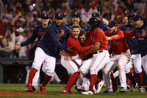 BOSTON, MASSACHUSETTS – OCTOBER 11: Enrique Hernandez #5 of the Boston Red Sox celebrates with teammates after they defeated the Tampa Bay Rays 6 to 5 during Game 4 of the American League Division Series at Fenway Park on October 11, 2021 in Boston, Massachusetts. (Photo by Winslow Townson/Getty Images)