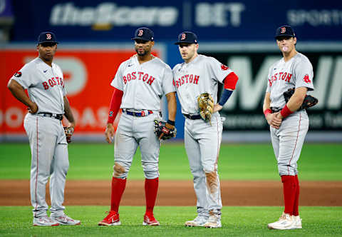 TORONTO, ON – APRIL 26: Rafael Devers #11, Xander Bogaerts #2, Trevor Story #10 and Bobby Dalbec #29 of the Boston Red Sox look on during a MLB game against the Toronto Blue Jays at Rogers Centre on April 26, 2022 in Toronto, Ontario, Canada. (Photo by Vaughn Ridley/Getty Images)