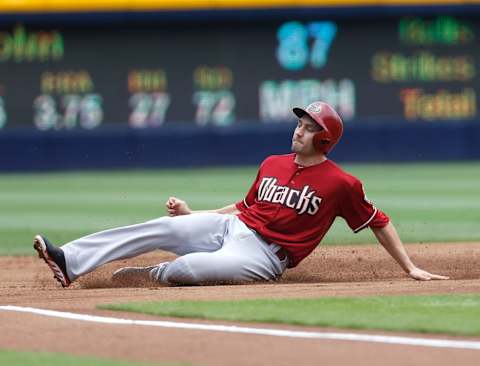 ATLANTA, GA – JUNE 30: Centerfielder A.J. Pollack #11 of the Arizona Diamondbacks slides into third base during the game against the Atlanta Braves at Turner Field on June 30, 2013 in Atlanta, Georgia. (Photo by Mike Zarrilli/Getty Images)