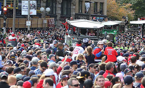 BOSTON, MA – NOVEMBER 2: The crowd at Boston City Hall Plaza cheers as the duck boats make their way down Tremont Street during the World Series victory parade for the Boston Red Sox on November 2, 2013, in Boston, Massachusetts. (Photo by Gail Oskin/Getty Images)