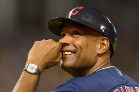 CLEVELAND, OH – AUGUST 13: First base coach Sandy Alomar Jr. #15 of the Cleveland Indians laughs at the fans during the sixth inning against the Arizona Diamondbacks at Progressive Field during the second game of a double header on August 13, 2014 in Cleveland, Ohio. (Photo by Jason Miller/Getty Images)