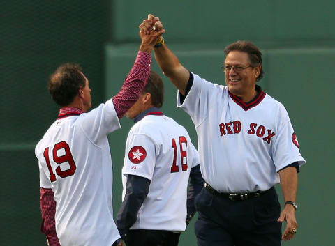 BOSTON, MA – MAY 5: MLB Hall of Fame player Carlton Fisk is greeted by Fred Lynn during a celebration of the 1975 American League Champions before a game between Boston Red Sox and Tampa Bay Rays at Fenway Park May 5, 2015 in Boston, Massachusetts. (Photo by Jim Rogash/Getty Images)