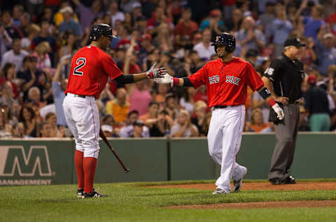 BOSTON, MA – JULY 24: Shane Victorino #18 of the Boston Red Sox celebrates with teammate Xander Bogaerts #2 after he scored against the Detroit Tigers on a Brock Holt #26 single during the third inning at Fenway Park on July 24, 2015 in Boston, Massachusetts. (Photo by Rich Gagnon/Getty Images)