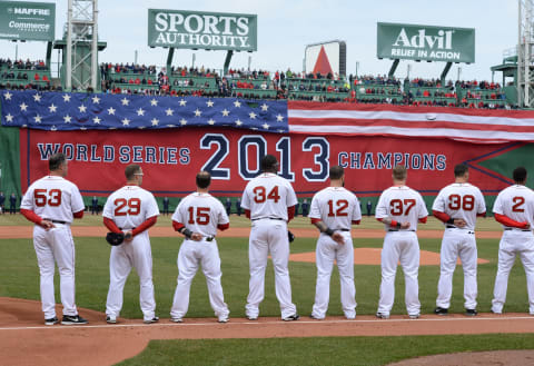 BOSTON, MA – APRIL 4: Members of the Boston Red Sox stand for the National Anthem during a ceremony honoring the 2013 World Series Champion Boston Red Sox before the start of a game against the Milwaukee Brewers at Fenway Park on April 4, 3014 in Boston, Masschusetts. (Photo by Michael Ivins/Boston Red Sox/Getty Images)