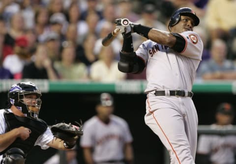 DENVER – JULY 17: Barry Bonds #25 of the San Francisco Giants hits a two-run double against the Colorado Rockies after being walked twice on July 17, 2004 at Coors Field in Denver, Colorado. The Giants won 4-0. (Photo by Brian Bahr/Getty Images)