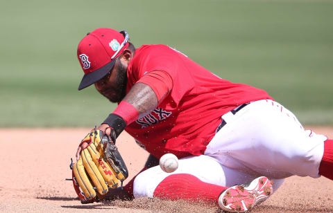 FORT MYERS, – MARCH 14: Pablo Sandoval #48 of the Boston Red Sox knocks the ball down at third base on the ground ball from Jason Rogers (not in photo) of the Pittsburgh Pirates an makes the play to first base for the out during the fourth inning of the Spring Training Game on March 14, 2016 at Jet Blue Park at Fenway South, Florida. The Pirates defeated the Red Sox 3-1. (Photo by Leon Halip/Getty Images)