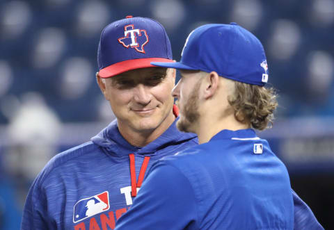 TORONTO, CANADA – MAY 2: Josh Donaldson #20 of the Toronto Blue Jays talks to manager Jeff Bannister #28 of the Texas Rangers before the start of their MLB game on May 2, 2016 at Rogers Centre in Toronto, Ontario, Canada. (Photo by Tom Szczerbowski/Getty Images)