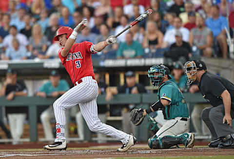 OMAHA, NE – JUNE 28: Third basemen Bobby Dalbec #3 of the Arizona Wildcats hits an RBI single against the Coastal Carolina Chanticleers in the first inning during game two of the College World Series Championship Series on June 28, 2016 at TD Ameritrade Park in Omaha, Nebraska. (Photo by Peter Aiken/Getty Images)