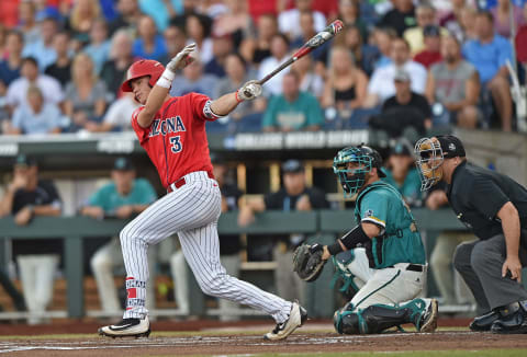 OMAHA, NE – JUNE 28: Third basemen Bobby Dalbec #3 of the Arizona Wildcats hits an RBI single against the Coastal Carolina Chanticleers in the first inning during game two of the College World Series Championship Series on June 28, 2016 at TD Ameritrade Park in Omaha, Nebraska. (Photo by Peter Aiken/Getty Images)