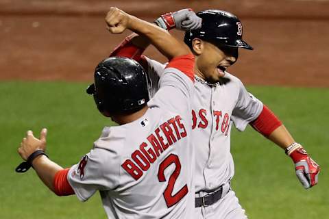 BALTIMORE, MD – SEPTEMBER 19: Mookie Betts #50 of the Boston Red Sox (L) celebrates with Xander Bogaerts #2 after hitting a two RBI home run in the third inning against the Baltimore Orioles at Oriole Park at Camden Yards on September 19, 2016 in Baltimore, Maryland. (Photo by Rob Carr/Getty Images)