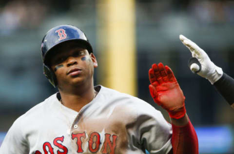 SEATTLE, WA – JUNE 14: Rafael Devers #11 of the Boston Red Sox is greeted at home plate as he scores on a double by Jackie Bradley Jr. #19 in the second inning against the Seattle Mariners at Safeco Field on June 14, 2018 in Seattle, Washington. (Photo by Lindsey Wasson/Getty Images)