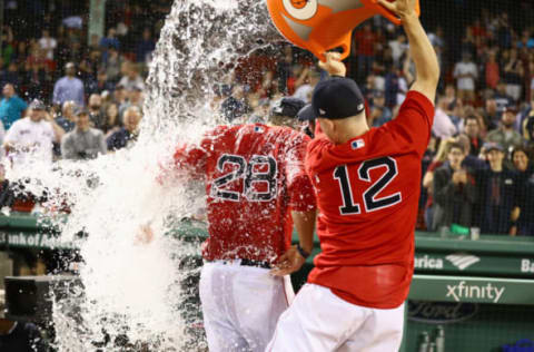 BOSTON, MA – JUNE 22: Brock Holt #12 of the Boston Red Sox throws ice water over J.D. Martinez #28 of the Boston Red Sox after beating the Seattle Mariners at Fenway Park on June 22, 2018 in Boston, Massachusetts. (Photo by Omar Rawlings/Getty Images)