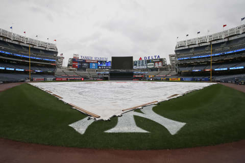 NEW YORK, NY – AUGUST 29: The tarp covers the infield as the game between the Cleveland Indians and New York Yankees has been postponed due to rain at Yankee Stadium on August 29, 2017 in the Bronx borough of New York City. (Photo by Rich Schultz/Getty Images)