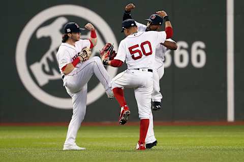 BOSTON, MA – OCTOBER 08: Andrew Benintendi #16, Mookie Betts #50 and Jackie Bradley Jr. #19 of the Boston Red Sox celebrate defeating the Houston Astros 10-3 in game three of the American League Division Series at Fenway Park on October 8, 2017 in Boston, Massachusetts. (Photo by Maddie Meyer/Getty Images)