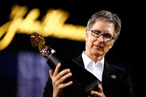 BOSTON, MA – OCTOBER 19: Boston Red Sox owner John Henry celebrates with the trophy after they defeated the Detroit Tigers in Game Six of the American League Championship Series at Fenway Park on October 19, 2013 in Boston, Massachusetts. The Red Sox defeated the Tigers 5-2 to clinch the ALCS in six games. (Photo by Jared Wickerham/Getty Images)