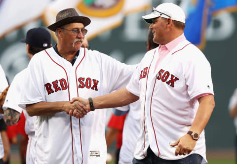 BOSTON, MA – MAY 25: Sammy Stewart shakes hands with Roger Clemens after the 1986 Red Sox were acknowledged on the 30th anniversary of being named American League Champions before the game between the Boston Red Sox and the Colorado Rockies at Fenway Park on May 25, 2016 in Boston, Massachusetts. (Photo by Maddie Meyer/Getty Images)