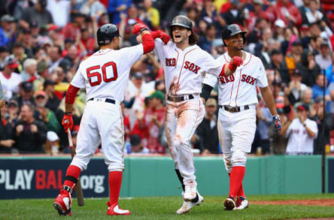 BOSTON, MA – OCTOBER 09: Andrew Benintendi #16 of the Boston Red Sox celebrates with Mookie Betts #50 after hitting a two-run home run in the fifth inning against the Houston Astros during game four of the American League Division Series at Fenway Park on October 9, 2017 in Boston, Massachusetts. (Photo by Maddie Meyer/Getty Images)