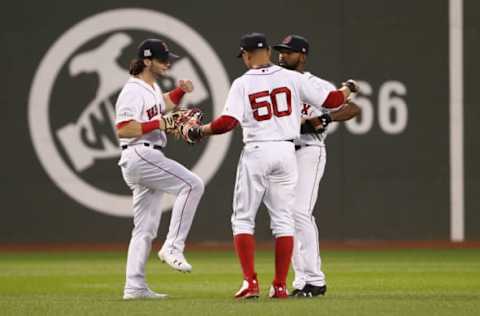 BOSTON, MA – OCTOBER 08: Andrew Benintendi #16, Mookie Betts #50 and Jackie Bradley Jr. #19 of the Boston Red Sox celebrate defeating the Houston Astros 10-3 in game three of the American League Division Series at Fenway Park on October 8, 2017 in Boston, Massachusetts. (Photo by Maddie Meyer/Getty Images)