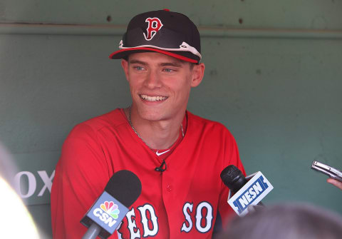 BOSTON, MA – JUNE 19: Trey Ball of the Boston Red Sox, seventh overall draft pick, meets the media in the Red Sox dugout before a game against the Tampa Bay Rays on June 19, 2013 in Boston, Massachusetts. (Photo by Gail Oskin/Getty Images)